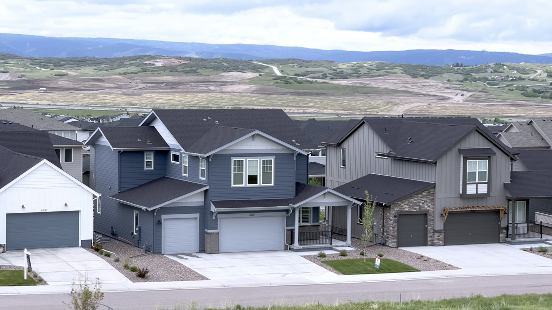 Traditional double garage doors on a Canadian home driveway